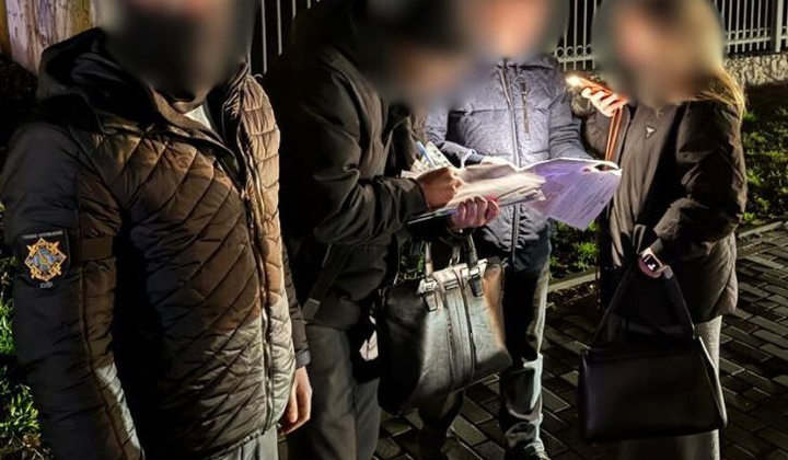 Kyiv resident listens to the message on the equipment