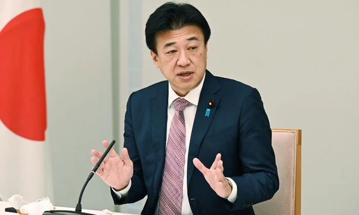Flags of Japan and Ukraine in background