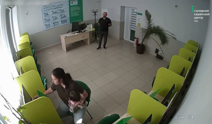 Soldier's wife taking exam at Ministry of Internal Affairs with daughter