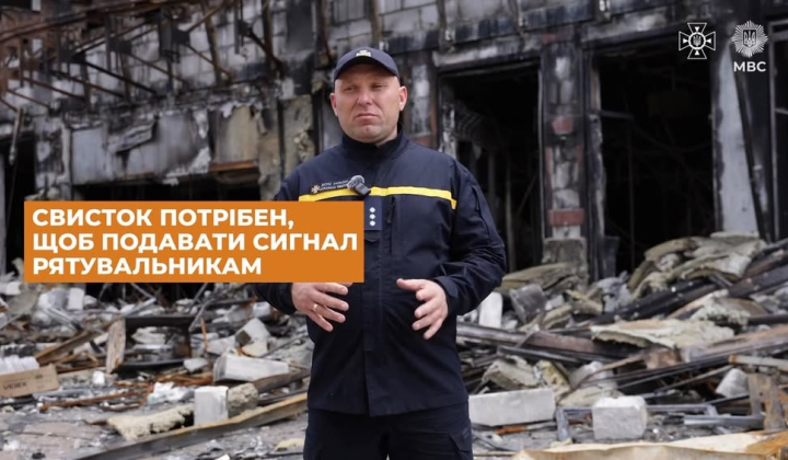 Rescuer with two essential items during shelling