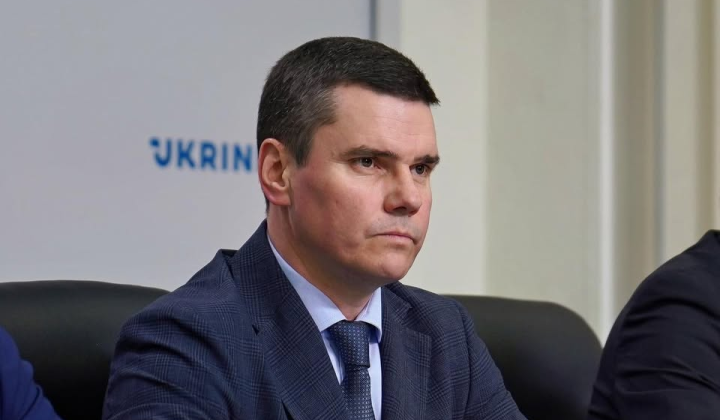 Deputy Minister Kovalchuk against a winter landscape