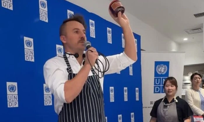 Japanese people enjoy borscht from Ukrainian fields