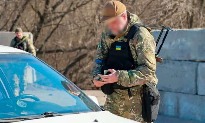 Driver hits military checkpoint