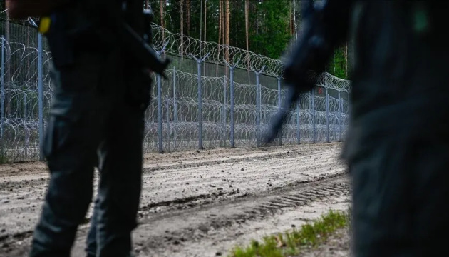 Latvian military stops migrants from Belarus