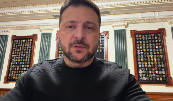 Zelensky with power station and gas pipelines in background