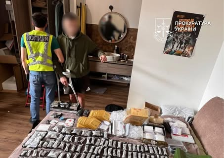 Confiscated cannabis and weapons from arrested drug dealers