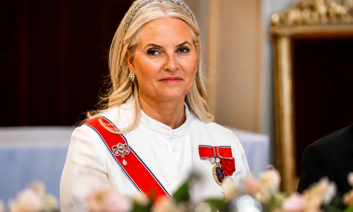Crown Princess of Norway playing guitar in hospital