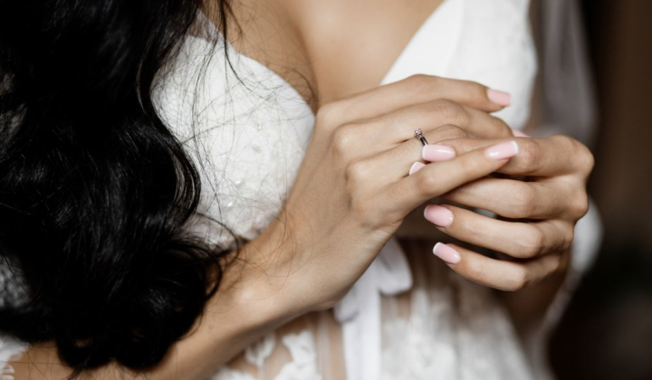 A wedding ring on a woman's finger
