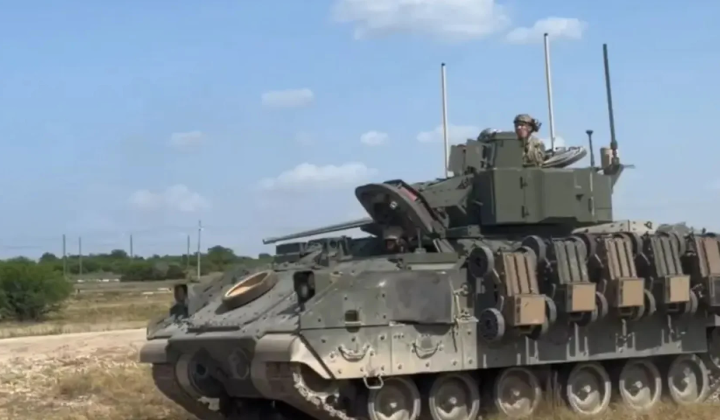The US Army experiments with transporting FireAnt robots on Bradley