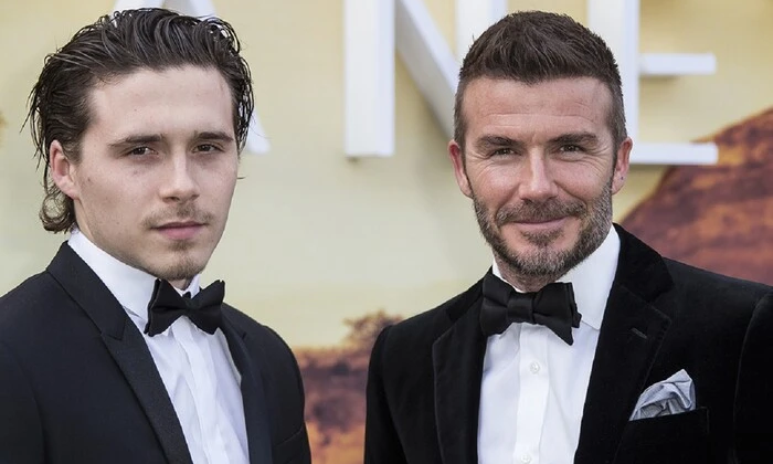 Brooklyn Beckham with parents through lawyers