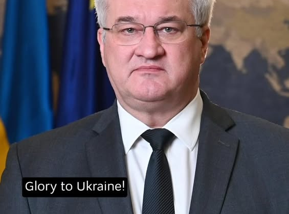 Andriy Sibiga with flag of Ukraine