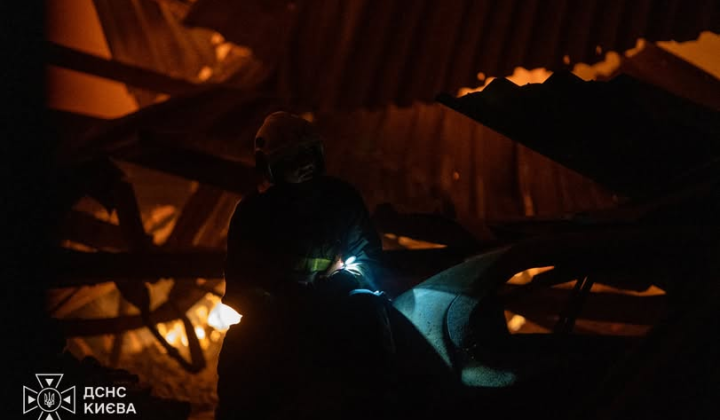 Firefighters extinguish a fire in Kyiv