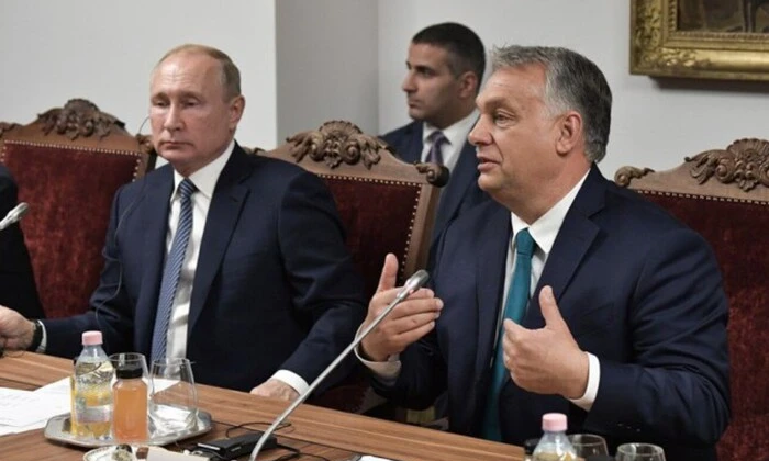 Kremlin logo and Orban's photo