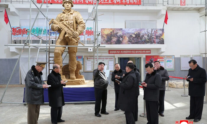 Kim Jong Un inspecting the monument