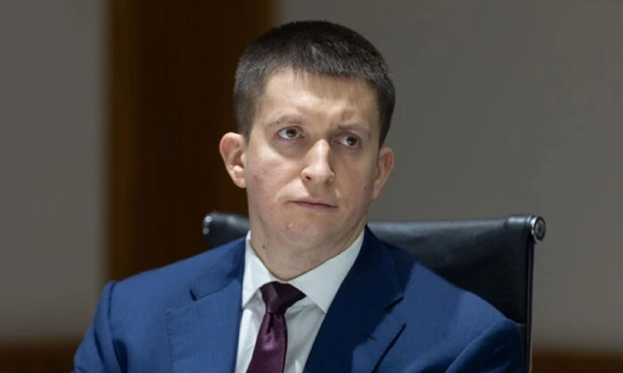 Portrait of Viktor Dubovik with ARMA in the background