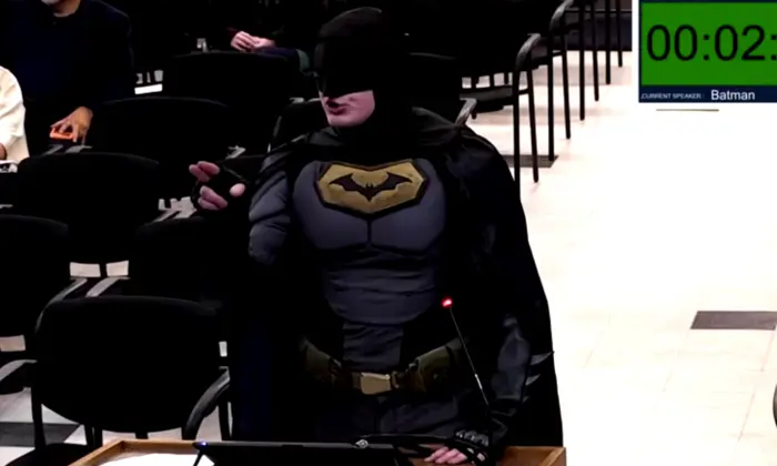Batman protests at city hall