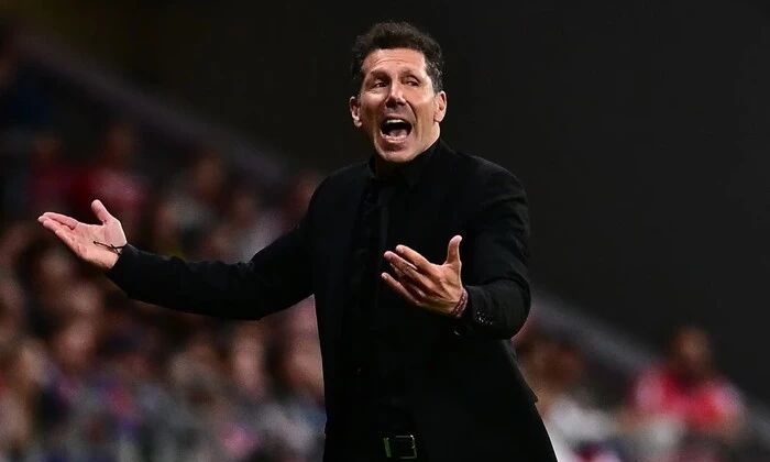 Diego Simeone on the field during the match