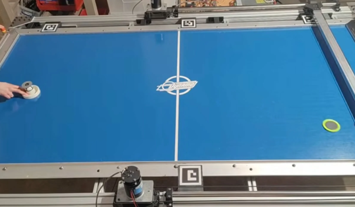 Robot playing air hockey at human level