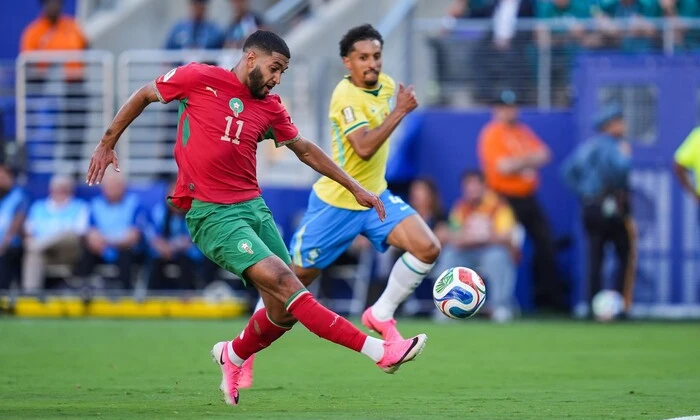 World Cup 2026 logo with flags of Netherlands and Morocco in the background