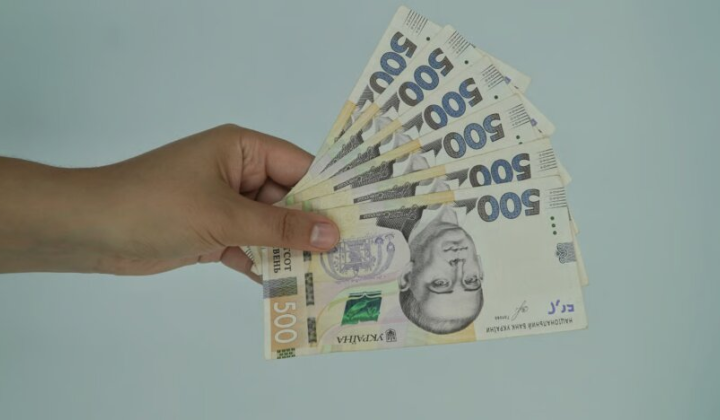 Person counting money for retirement