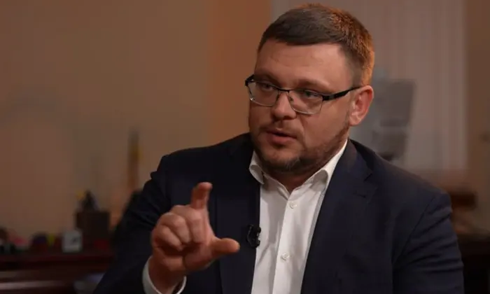 Логотип НАБУ на тлі графіків