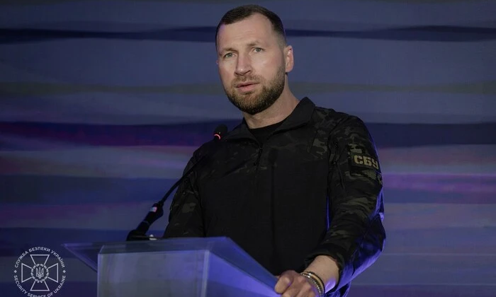 Portrait of V.Putin with Russian flag background