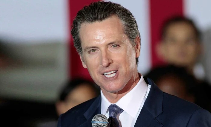 Newsom depicted as a tyrannosaur