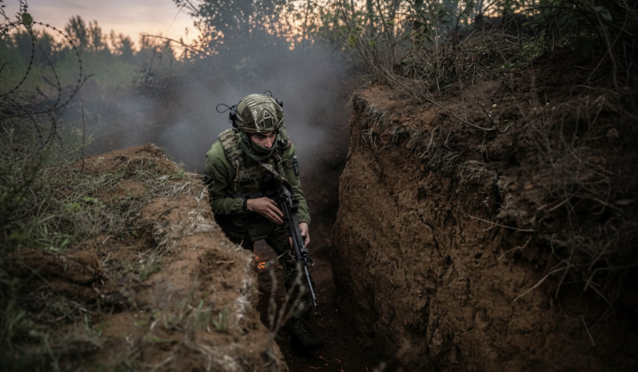 Soldiers in trenches with written book