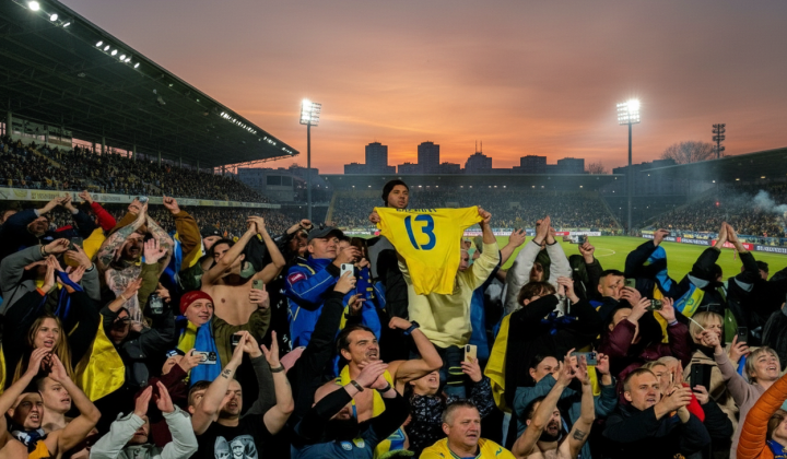 Flags of Ukraine and Sweden against the background of soccer balls