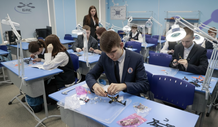 Children learning to control drones in 'Warrior Centers'