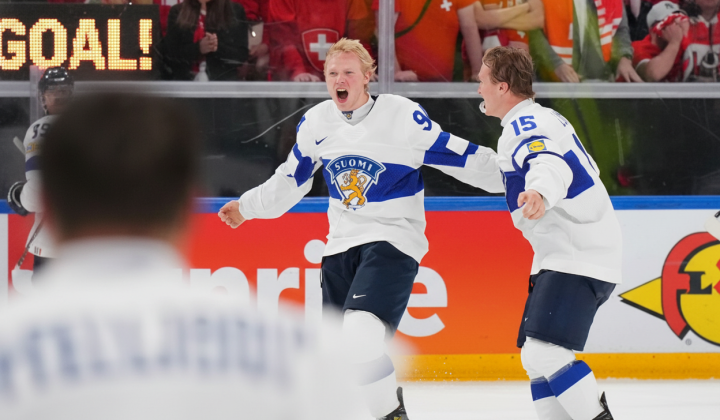 Finland's players celebrating victory in hockey