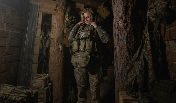 Combat nurse evacuates the wounded to the front lines