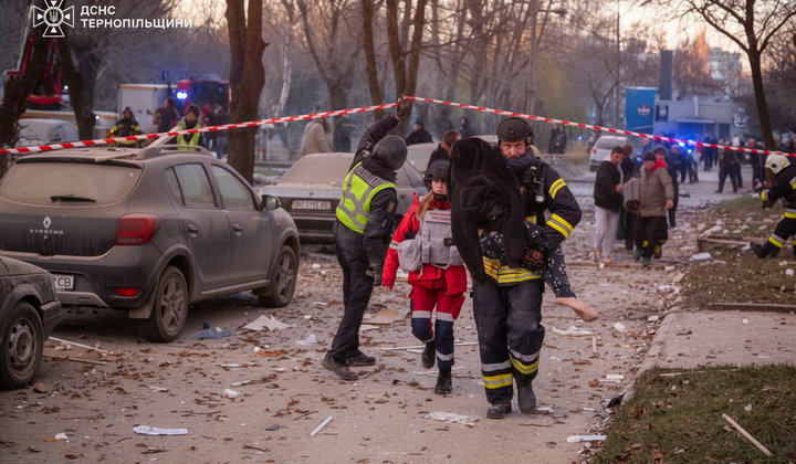 Rescuers visit the boy under the rubble