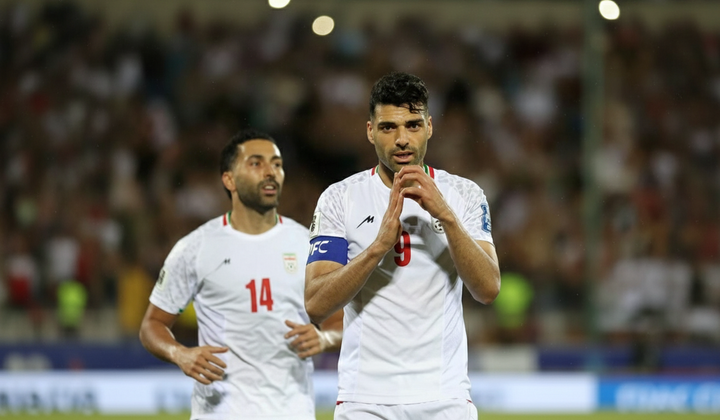 Flag of Iran and a football