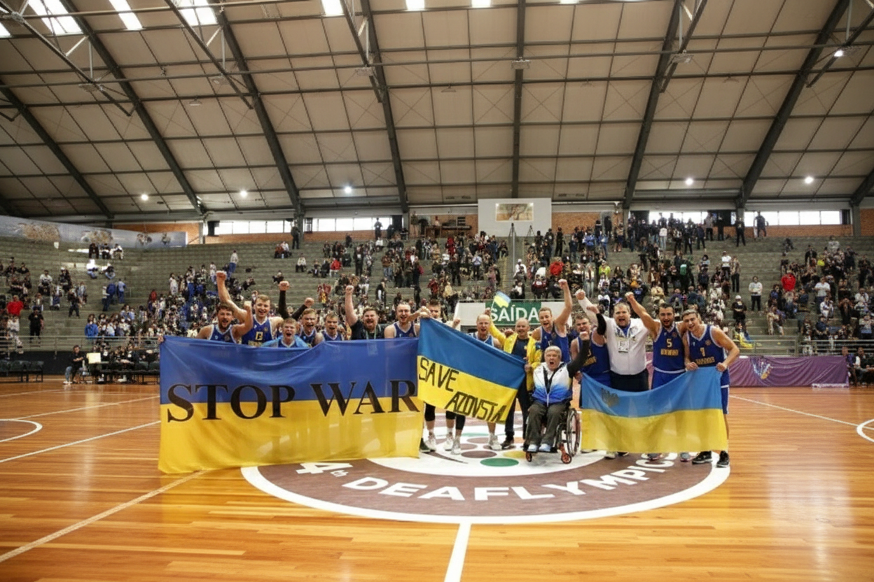 Українські спортсмени на фоні логотипу Дефлімпіаді-2025